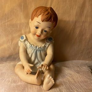 Girl Figurine-she is sitting w/blue gown, beautifully painted